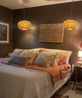 Plug In Pendant Light With Handwoven Bamboo Shade, Double Layer Boho Wicker Rattan Hanging Lamp in cozy bedroom setting