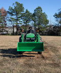 Front view of 5 Foot Dirt Bucket Attachment For Tractors That Fits John Deere Hook And Pin Tractors in open field