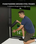 Person demonstrating foam padding on Golf Simulator Enclosure For Home 10x8 ft Cage with HD Impact Screen, safe for practice