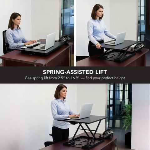 Three views of a 32 by 22 inch standing desk converter with gas spring lift, showing sit-stand use in an office setting.