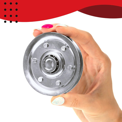 Hand holding a metal pulley from the All In One DIY Friendly Garage Door Cable Replacement Kit with galvanized aircraft cables.