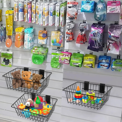 Slatwall Storage Baskets 2 Pack Matte Black Metal Wire Organizer Bins For Wall Panels 11.75 In Wide By 7.875 In Deep By 4 In High Tool Free Mounting Scratch Resistant Finish Durable Slatwall Organizer filled with toys on a slatwall panel.