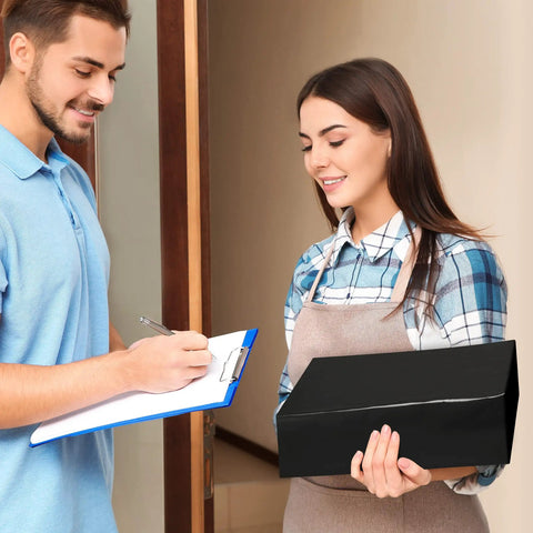 Customer receiving package in a Heavy Duty 14.5x19 Black Poly Mailers 50 Pack Self Sealing Shipping Bags For Clothing With Strong Adhesive Tough Durable Plastic Envelopes For Easy Ecommerce Packaging And Retail Shipments.