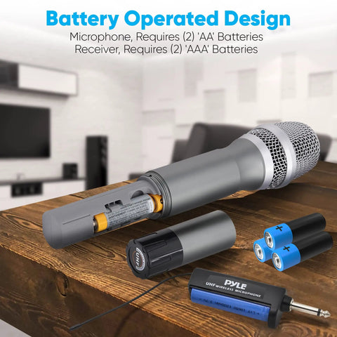 Dual UHF Wireless Microphone System with battery compartment open, showing AA batteries, receiver, and USB port on a table
