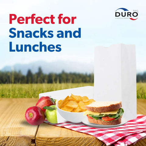 White Paper Bags with SOS Bottom, 500-Count, Size 5.00 x 3.12 x 9.75 Inches beside sandwich, chips, and fruit