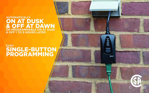 Outdoor Plug In Digital Timer With Weatherproof Housing Featuring Built In Photocell Light Sensor For Patio And Garden Illumination on brick wall