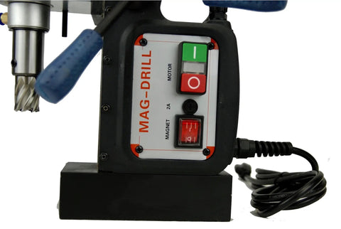 Close-up of Badass Magnetic Drill With Integrated Knock Out Mode For Serious Construction Grinds power controls and shank.