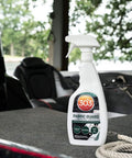 Boat Cover And Canvas Protector Spray 16 Oz Six Pack Restores Water And Stain Repellency Keeps Fabric Dry Resists Water Based And Oil Based Stains Will Not Alter Color Or Breathability; 303 Fabric Guard bottle on boat deck