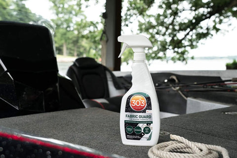 Boat Cover And Canvas Protector Spray 16 Oz Six Pack Restores Water And Stain Repellency Keeps Fabric Dry Resists Water Based And Oil Based Stains Will Not Alter Color Or Breathability; 303 Fabric Guard bottle on boat deck