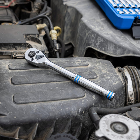 Three Eighths Inch Ratchet Wrench With Hundred Tooth Reversible Gears on engine, Eight Inch Long Handle, Chrome Vanadium Steel