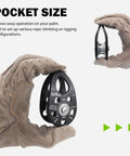 Slack Tending Pulley Kit For Doubled Rope Climbing DDRT System micro pulley in gloved hand, pocket size view