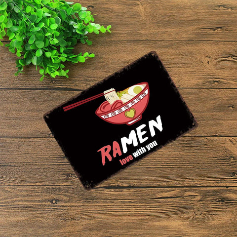 Ramen Love Dope Vintage Rustic Metal Tin Sign 8x12 Inch Wall Art on a wooden surface with a plant beside it.