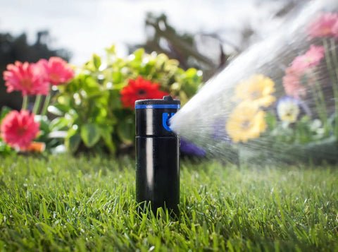 PGP Ultra Rotor Sprinkler Head With 4 Inch Pop Up And 3 Quarter Inch Inlet Pressure Regulated Body in operation on grassy lawn