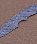 Dope Damascus Skinning Knife Set Four Piece Hand Forged Full Tang Blades, close-up of intricate Damascus pattern blade on leather surface.