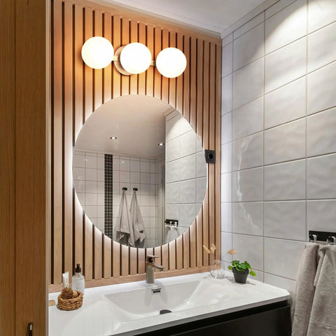Modern 3 Light Globe Vanity Light Fixture Brushed Nickel Wall Mount Sconce above round bathroom mirror with opal glass shades