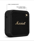 Black Willen II Portable Bluetooth Speaker with USB-C charging and control knob, rugged waterproof and dust proof design, brass accents.