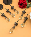 Set Of 6 Clear Glass Iris Knobs For Cabinets Drawers Doors And Wardrobes Modern Sleek Hardware Upgrade For Kitchen Cupboard Dresser And Drawer Pulls Rich Glass Finish displayed on a surface with red rose decoration