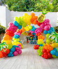 Hawaiian Summer Balloon Arch Kit With 129 Pieces In Hot Pink Teal Blue Lime Green Yellow Orange And Confetti For Totally Dope Tropical Party Vibes And Easy Indoor Outdoor Celebrations displayed outdoors.