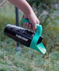 Hand using All Season Handy Seed Spreader For Lawn Care Pro Grade Adjustable Grass Seed And Fertilizer Spreader