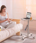 Mobile Laptop Cart On Wheels With Adjustable Height From 29.7 To 45.2 Inches Standing Rolling Desk beside couch with laptop