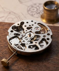 Automatic Skeleton Watch Movement For Wristwatch Repair And Watchmaking Parts Copper Silver Finish on wooden table