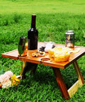 Portable Wine Picnic Table in Acacia Wood With Larger Foldable Tray Charcuterie Board Surface For Camping Glamping Concerts on grass