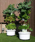 Two Dope Hydroponic Tower For Vertical Gardening Self Watering Self Lighting Grow Kit with 24 Net Pots on outdoor lawn