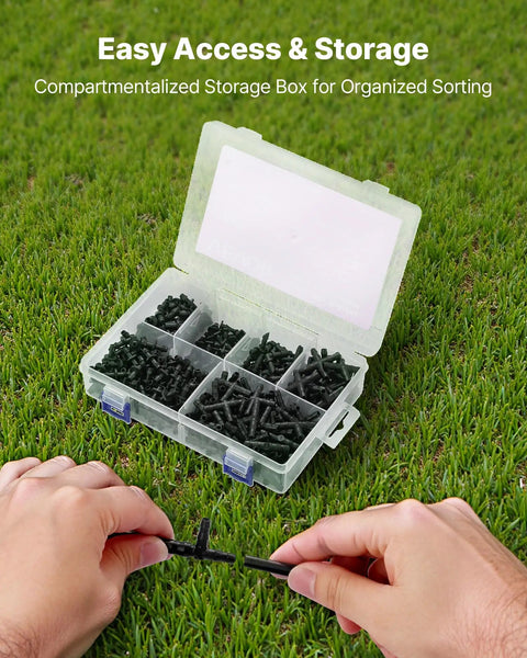Ultimate 300 Piece Drip Irrigation Fittings Kit For Quarter Inch Tubing With open box on grass showing assorted parts
