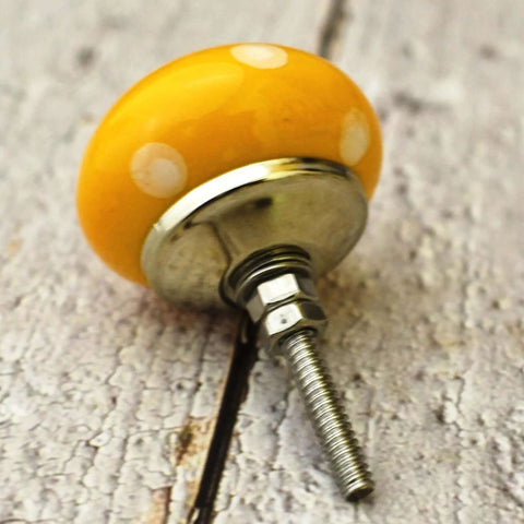 Real Deal Handmade Yellow And White Ceramic Cabinet Knobs Set Of 10 Slick Round Drawer Pulls For Kitchen Cupboards And Furniture Upgrades Smooth Engraved Finish close-up of yellow ceramic knob.