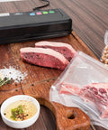 Vacuum Sealer Machine CPVS 290R Heavy Duty for sealing liquid bags with meat and nuts on a wooden countertop