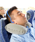 Man using Silicone Ear Plugs With Corded Design For Sleep Shooting Travel And Work Site Hearing Protection Reusable Inner Aural Ear Plugs Includes 18 Pairs Of Replacements Soft Washable For All Day Comfort And Noise Reduction on a bus