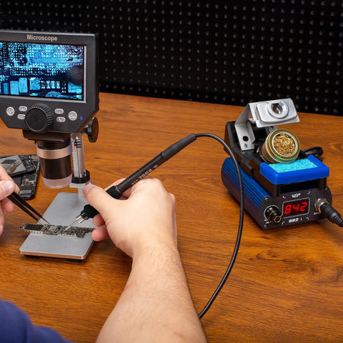 Pro Grade Precision Soldering Iron Station With Temperature Control Preset Channels C to F Conversion Sleep Mode Auto Shutdown Calibration Tools Compatible With C210 Tips For Micro Component Soldering in use beside microscope