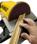 Heavy Duty 4 By 36 Belt And 8 Inch Disc Sander With 7 Amp Motor showing hand applying wood to sanding disc for precision finishing.