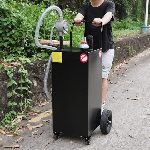 Person transporting 40 Gallon Gas Caddy With Four Wheels Portable Heavy Duty Fuel Tank Includes Manual Transfer Pump For ATV Boat Tractor Lawn Mower And Motorcycle Black Gasoline And Diesel Compatible Spill Proof Cap Wide Mouth Neck Long Flow Hose on pathway.