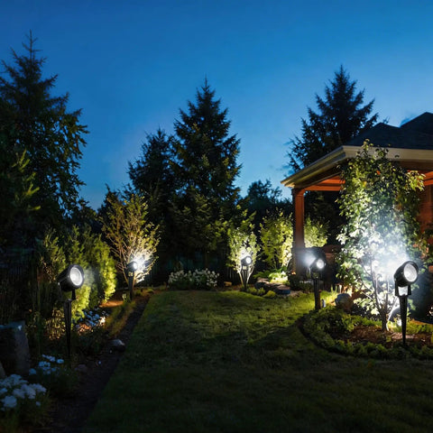 10 Pack 5W Outdoor LED Landscape Spotlights, 5000K Daylight Brightness For Flags And Gardens, Waterproof Low Voltage 12V-24V AC DC Yard Light, illuminating a garden at night.