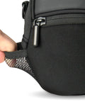 Close-up of mesh pocket on black weatherproof compact camera case with padded interior and accessory pockets, slim digital pouch