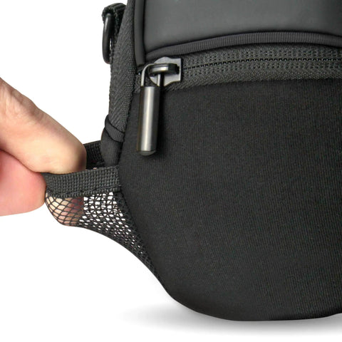 Close-up of mesh pocket on black weatherproof compact camera case with padded interior and accessory pockets, slim digital pouch