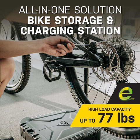 Person using All In One Bike Storage And Charging Station With Adjustable Tool Organizer Box, Modular Add On Support, 77 Lb Capacity, Aluminum Frame For Home Or Garage Setup with bike and tool box visible