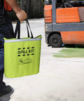 Person carrying Fast Acting Grab-And-Go Spill Response Kit With Water-Resistant High-Visibility Yellow Duffle Tote Includes 10 Universal Sorbent Pads 2 Sorbent Socks 3x4 1 Disposal Bag And Nitrile Gloves For Quick Cleanup And Leak Control.