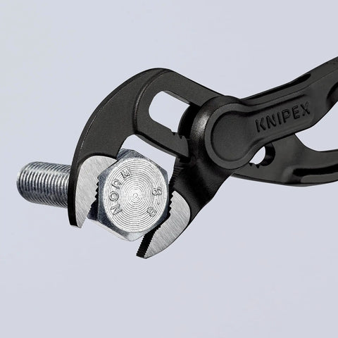 Cobra XS Mini Water Pump Pliers, 100 Mm gripping a metal nut, showing self-locking feature and slim head for tight spaces.