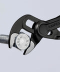 Cobra XS Pipe Wrench and Water Pump Pliers gripping a bolt, slim head design for tight spaces, atramentized surface, 100 mm length.