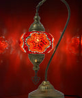 Swan Neck Mosaic Turkish Table Lamp With Handcrafted Glass Bead Mosaic, red stained glass globe, brass base, lit on red background