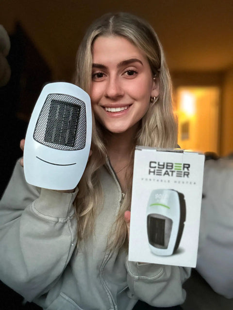 Smiling person holding a Portable Space Heater With Remote, 500W Ceramic Electric Heater for Small Bedroom, Office, or Garage.
