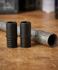 Four Piece 22mm Threaded Tips Replacement For Broom Handles And Household Cleaning Tools Plastic Multi Tool Adapter Screw On Connector For Reliable Repair, two plastic adapters next to a metal pole.