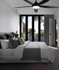 Modern bedroom with Indoor Ceiling Fan With 56 LED Lights, 5-Blade Black Fan With Remote, showcasing quiet motor and sleek design.