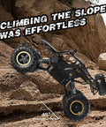 One Twelve Scale RC Off Road Monster Truck With Metal Shell And LED Headlights climbing rocky terrain at 45-degree angle