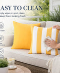 Outdoor Pillow Covers Set Of 2 18x18 Waterproof Throws on patio couch with person wiping striped cushion