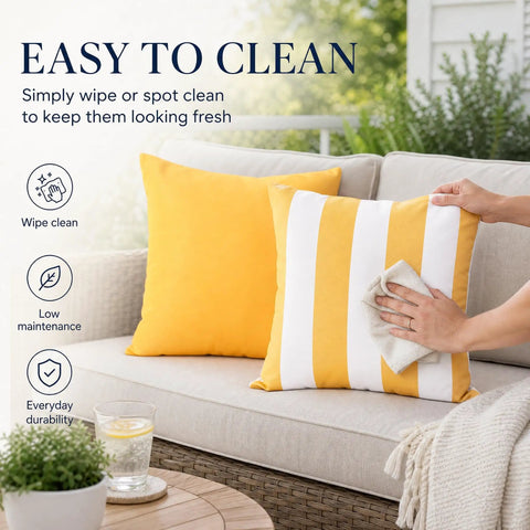 Outdoor Pillow Covers Set Of 2 18x18 Waterproof Throws on patio couch with person wiping striped cushion