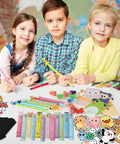 Children using 24 Pack Cute Stationery Set for classroom rewards featuring pencils, erasers, rulers, stickers, goodie bags on table.