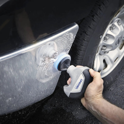 Cordless Power Scrubber Auto Detailing Kit With Four Cleaning Pads, Bristle Brush, Splash Guard, And Charger in use on car bumper